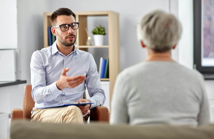 Doctor And Client In Behavioral Therapy At Arizona Rehab