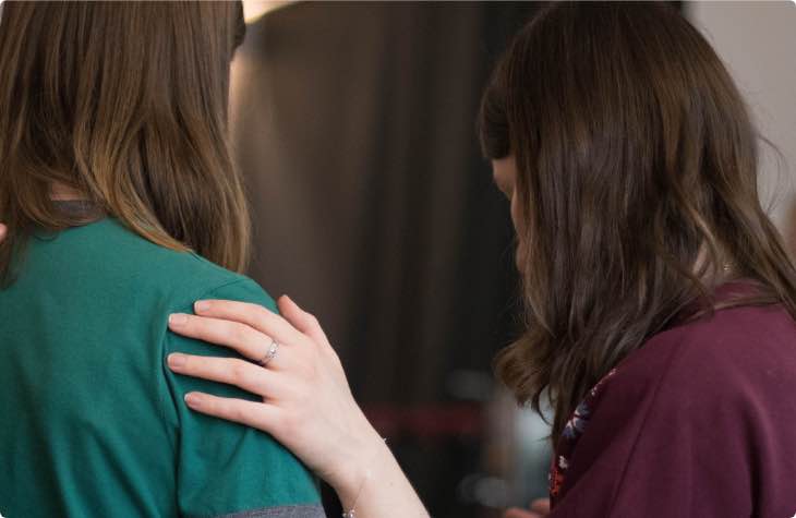 Woman Placing Hand On Shoulder At Rehab In Arizona