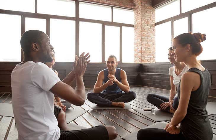 Group Of People Recovering From Addiction Practicing Mindfulness