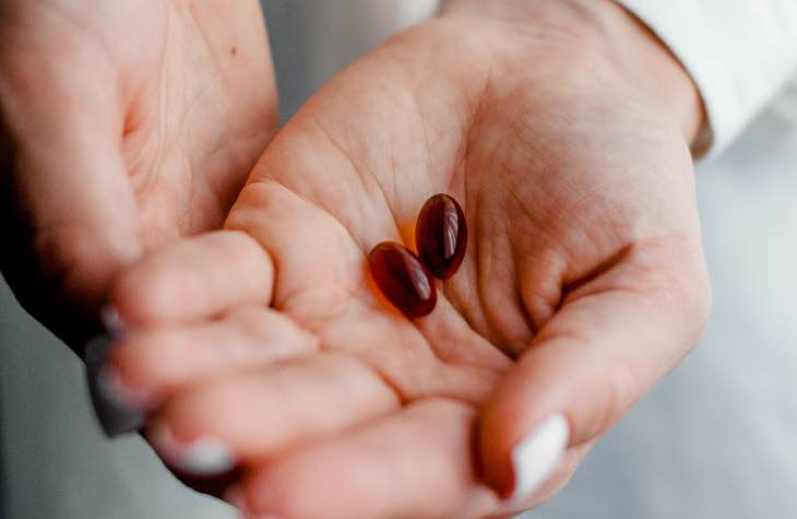 Hand Holding Pills For The MAT Opioid Treatment Options Available