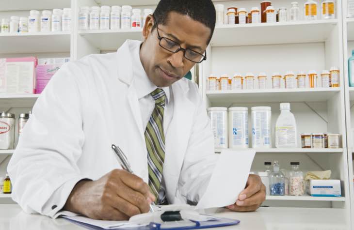 Pharmacist Documenting Medication Prescriptions For Alcohol Addiction