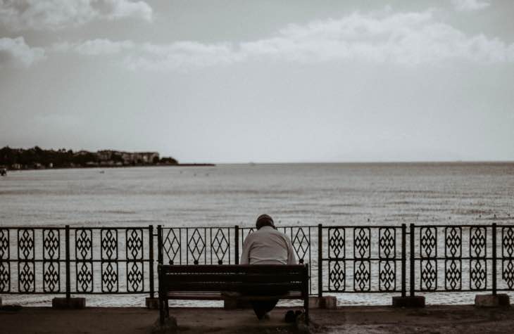 Person On A Bench Exhibiting The Signs Of Alcoholism