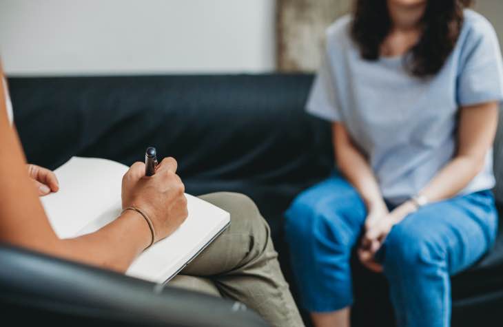 Therapist Working With Client As Part Of Alcohol Therapy Treatments