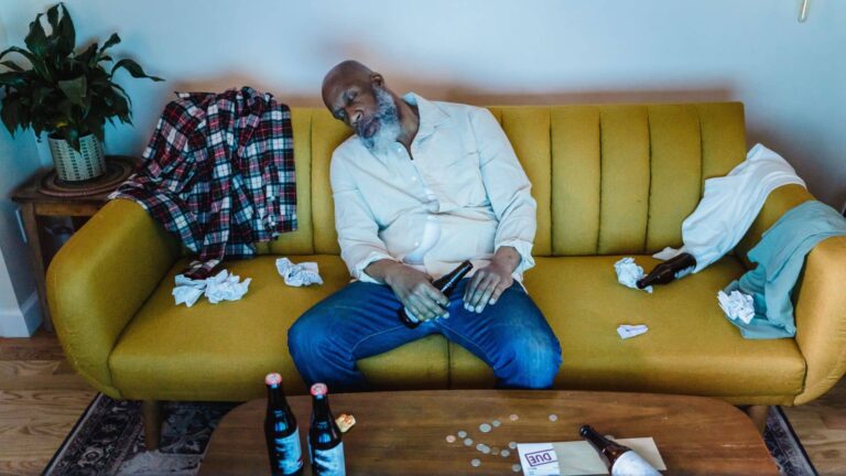 Man suffering from alcohol poisoning after binge drinking