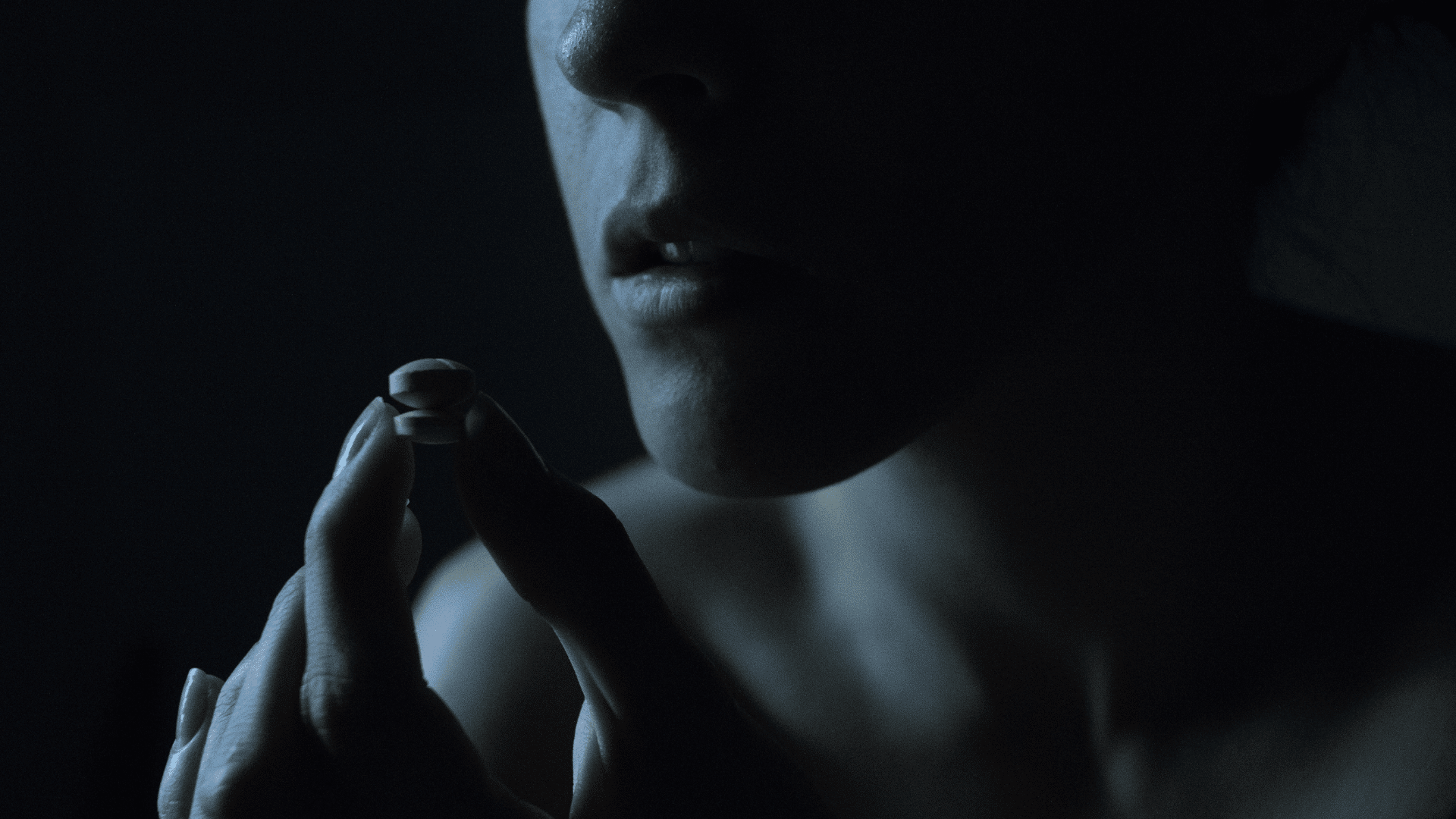 girl using pills highlighting opioid addiction in young adults