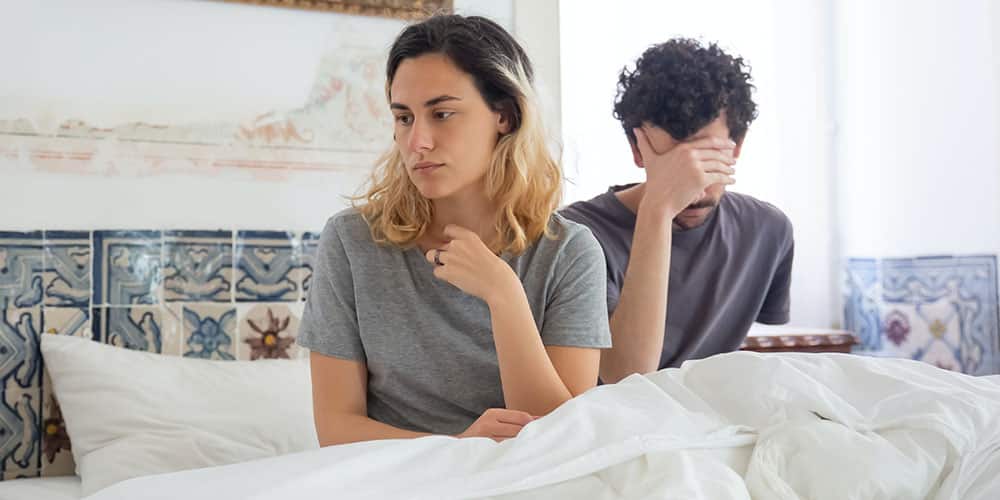 photo example of couple in bed experiencing sexual issue