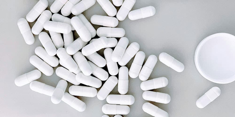 photo of white capsules in the table
