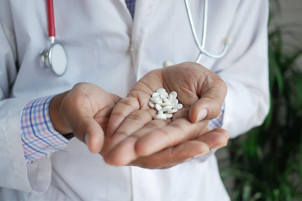photo representing a doctor-assisting patient with medication