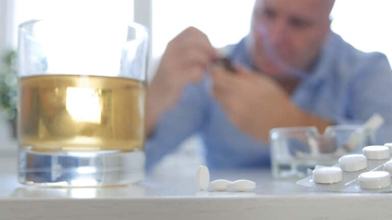 Man Making Abuse Take Pills and Consume Alcohol
