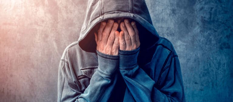 desperate man in hooded jacket