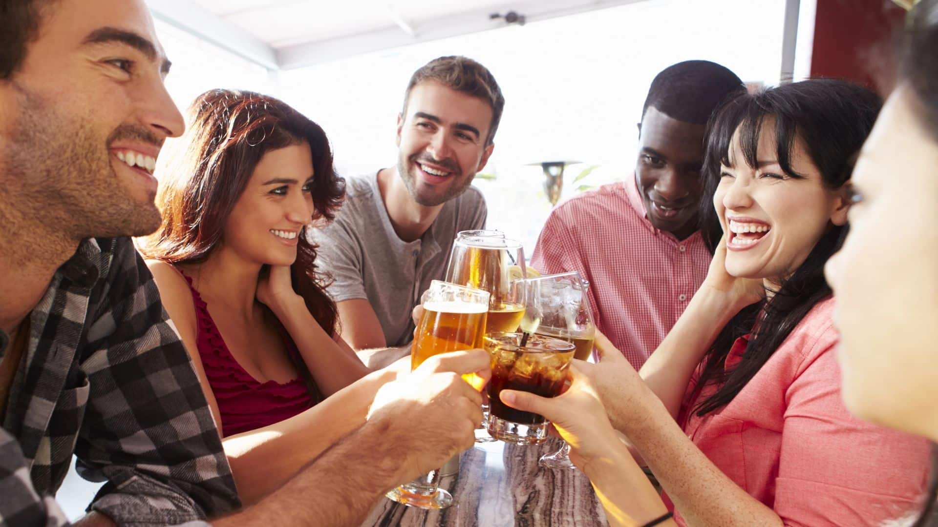 Friends Enjoying Drinks At Rooftop Bar