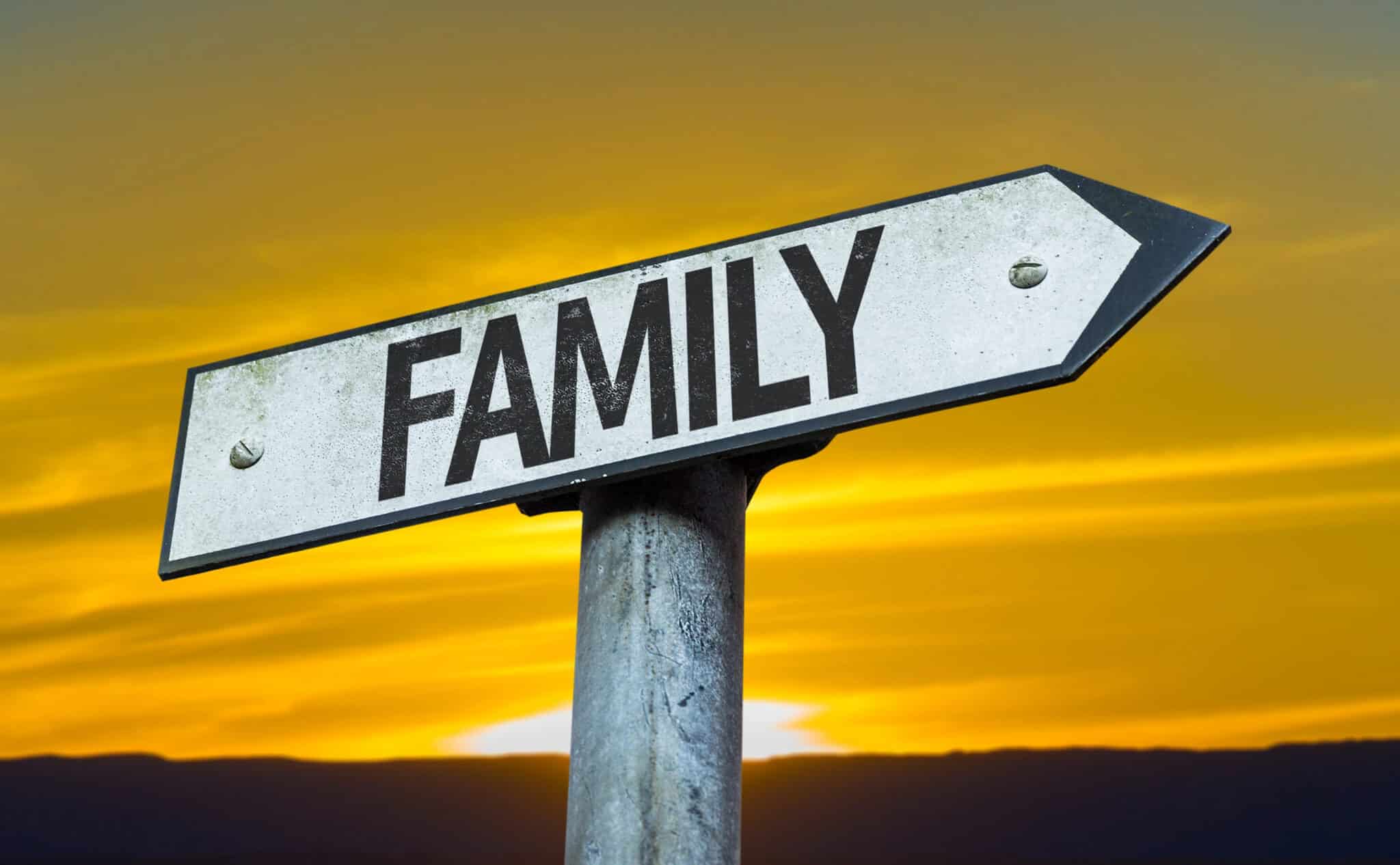 family sign with a sunset