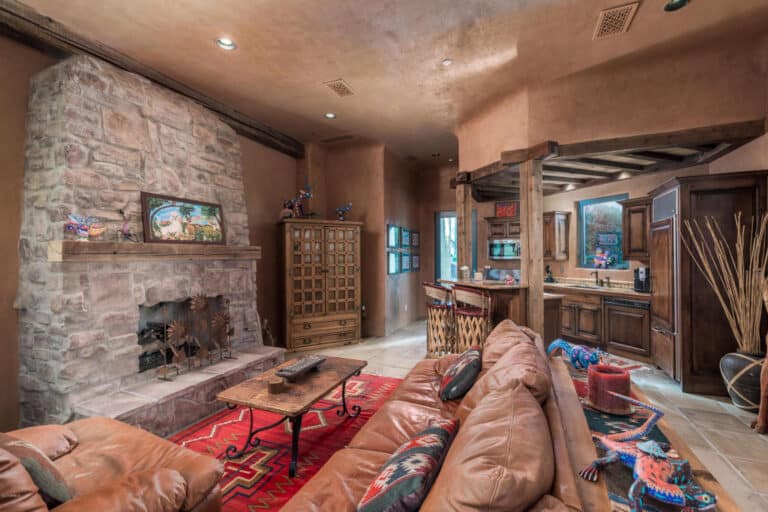 Cozy living room interior with stone fireplace and comfortable seating at The Hope House rehabilitation center.