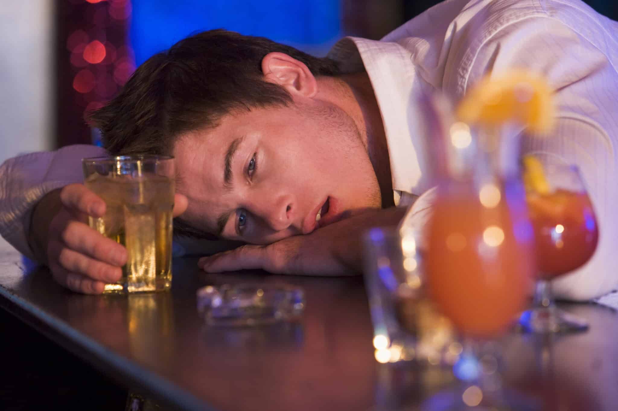 drunk young man resting head