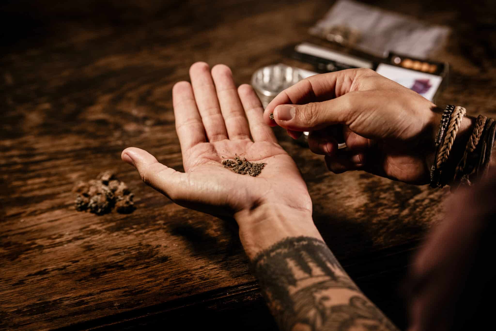 man preparing weed