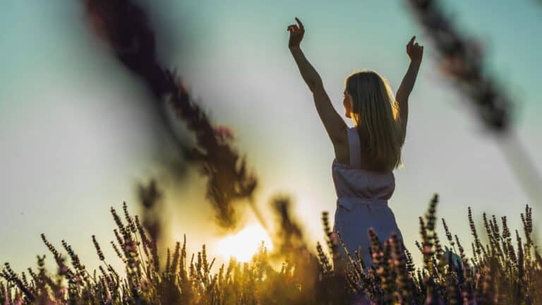 young girl in a white summer dress on a lavender field