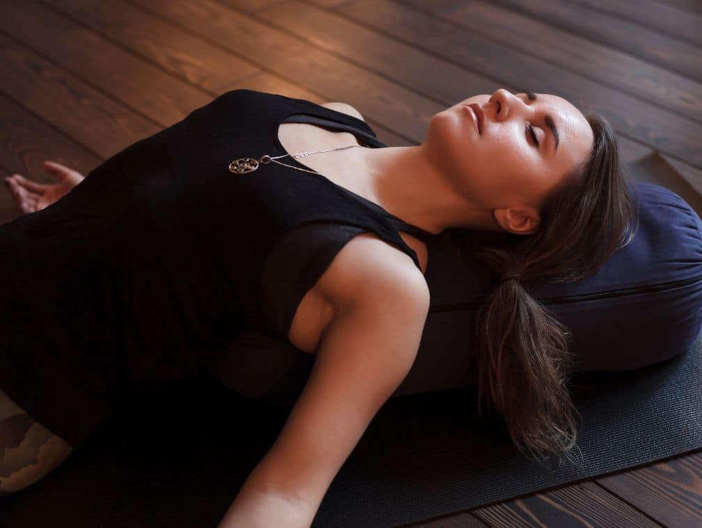 Woman resting in shavasana