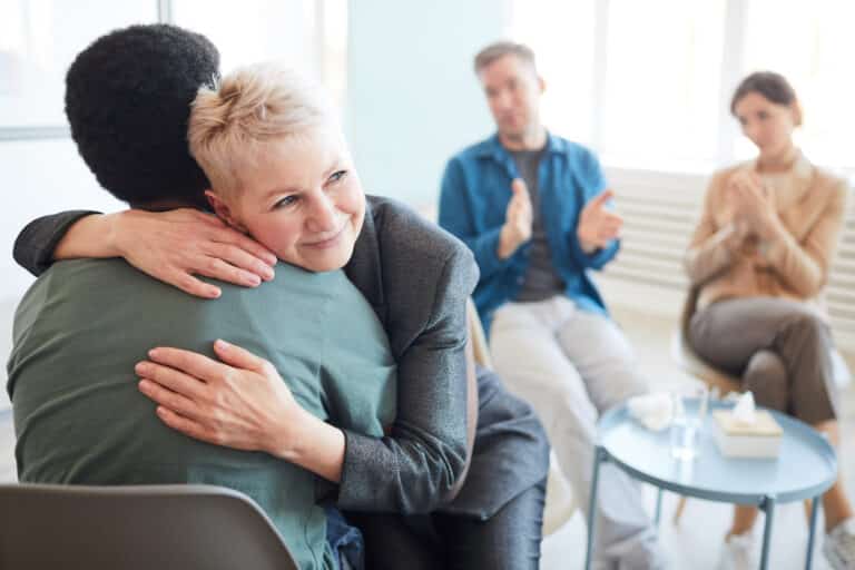 mature psychologist embracing patient in support g 2025 03 05 20 21 19 utc