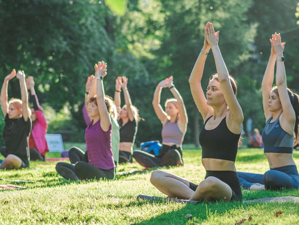 yoga or gym on the grass in a public park in summer