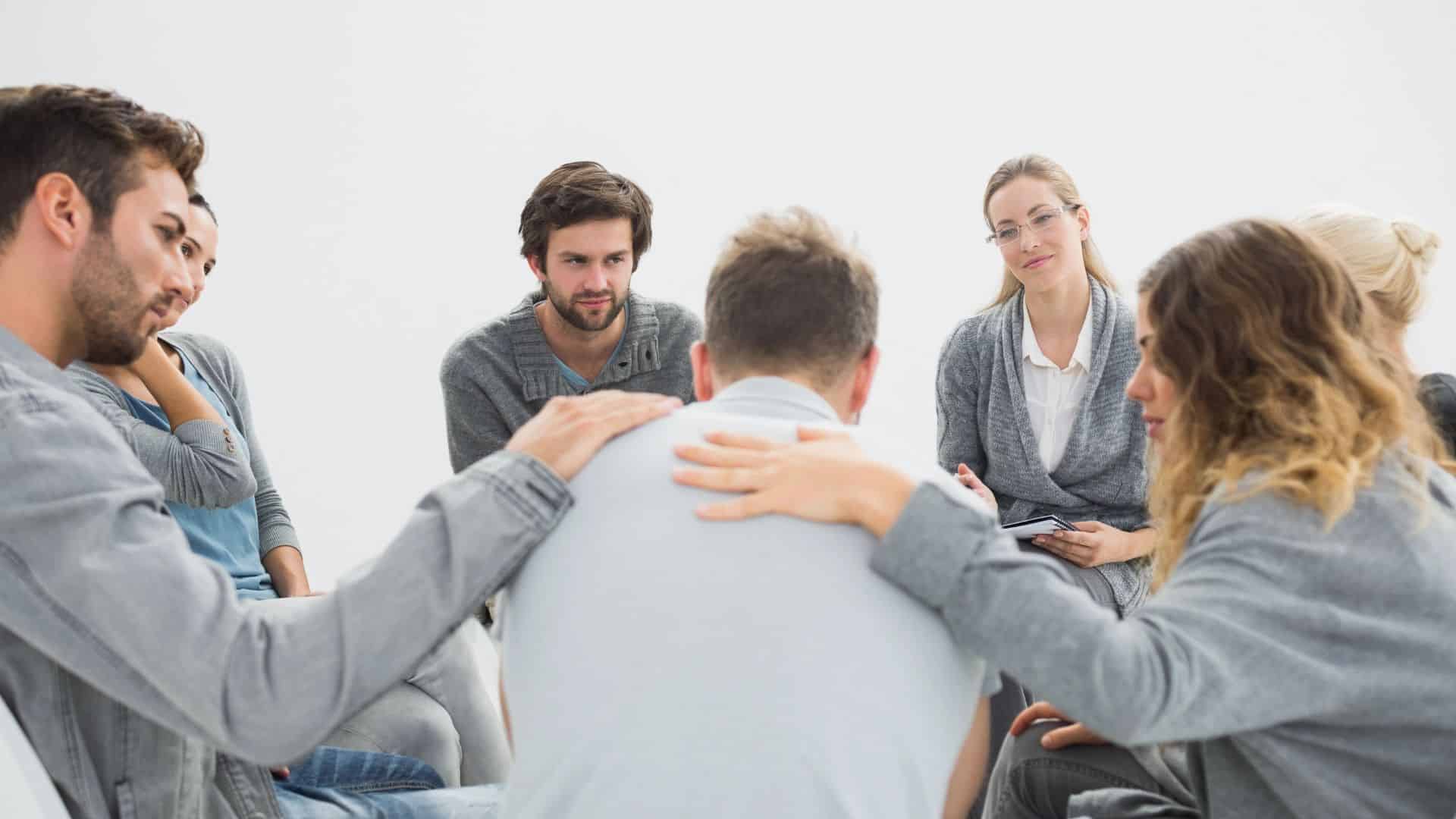 Group therapy in session sitting in a circle