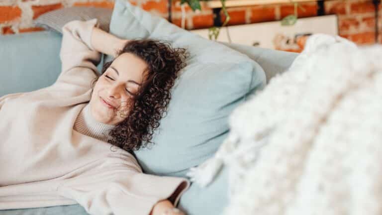 relaxing on a comfortable sofa in a cozy indoor setting