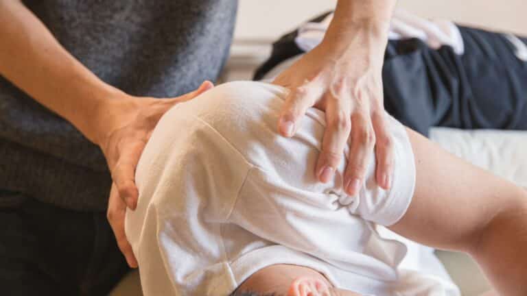 massage therapist working on a client's back
